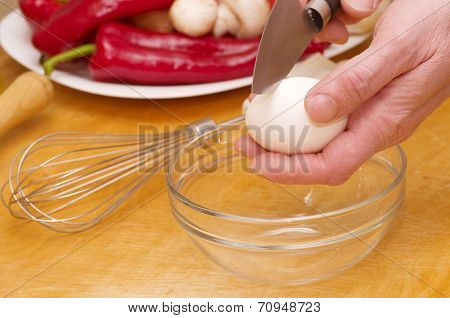 Chef baker cracking an egg
