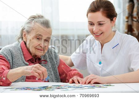 Senior Woman With Her Elder Care Nurse