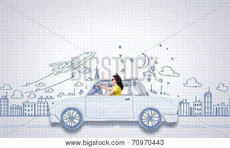 Young woman riding car made of list of paper