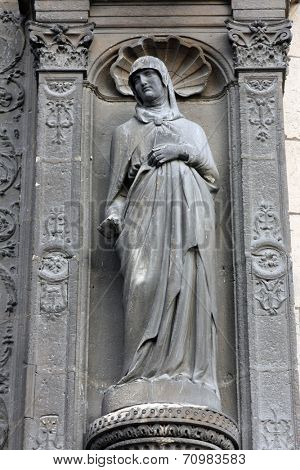 PARIS, FRANCE - NOV 11, 2012: Statue at the south portal of the church of St. Eustache in Paris, France on November 11, 2012