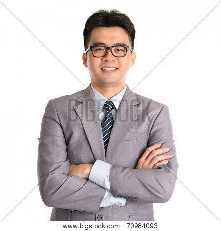 Portrait of Asian business man arms folded smiling, standing isolated on white background.