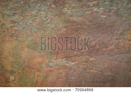 flat, multi color foliated slate rock with abstract  pattern