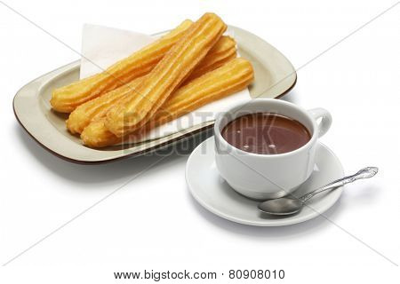 churros and hot chocolate on white background, spanish breakfast