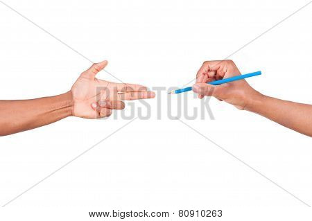 Isolated African Hand Making Gun Gesture To A Hand Holding A Pen