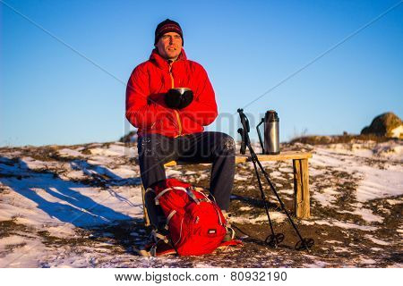 Hiker in winter mountains snowshoeing.
