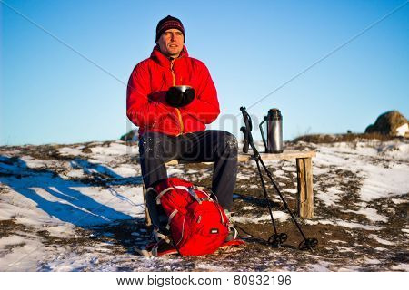 Hiker in winter mountains snowshoeing.