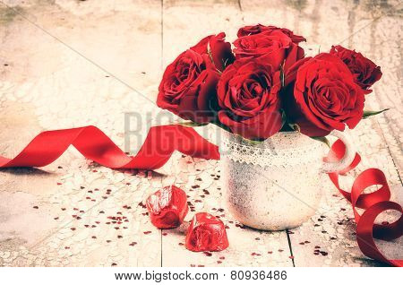 Valentine's Setting With Bouquet Of Red Roses And Chocolate