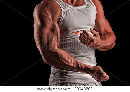 A Muscular Man With A Syringe