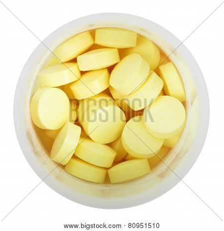 Yellow Pills In Round Plastic Bottle Close Up