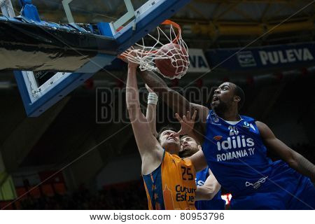 VALENCIA, SPAIN - JANUARY 21: Loncar with ball and Cooper 20 during Eurocup match between Valencia Basket Club and CSU Asesoft at Fonteta Stadium on January 21, 2015 in Valencia, Spain