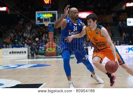VALENCIA, SPAIN - JANUARY 21: Vives with ball and Hayes during Eurocup match between Valencia Basket Club and CSU Asesoft at Fonteta Stadium on January 21, 2015 in Valencia, Spain