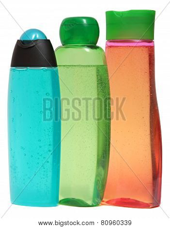 colored plastic bottles with liquid soap and shower gel.