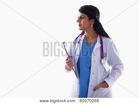 Young doctor or medic with clipboard and stethoscope standing on white  background