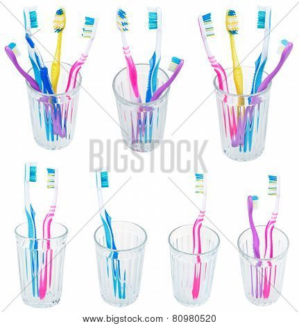 Collection Of Toothbrushes In Glases Isolated