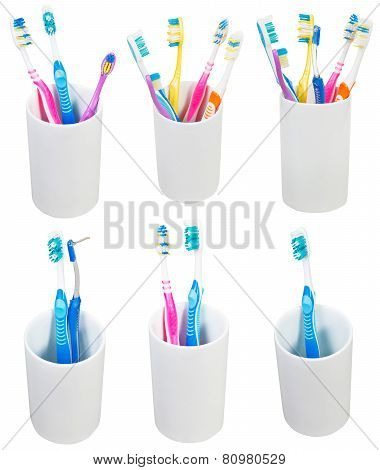 Collection Of Toothbrushes In Ceramic Glases
