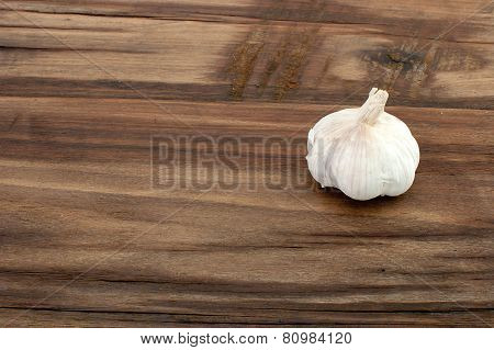 Garlic On Old Wooden Table For Meal.