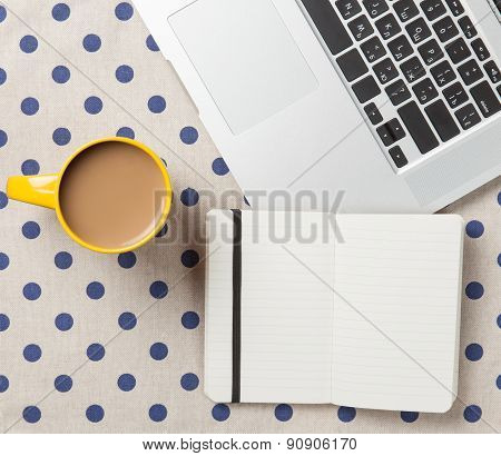 Cup And Notebook Near Laptop Comuter