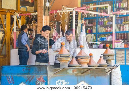 TADDERT, MOROCCO, APRIL 15, 2015: Local cooks prepare traditional tagines in front of the restaurant