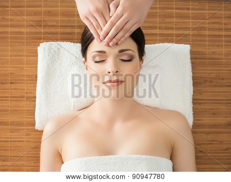 Young, beautiful and healthy woman in spa salon. Traditional oriental massage therapy and beauty treatments. 