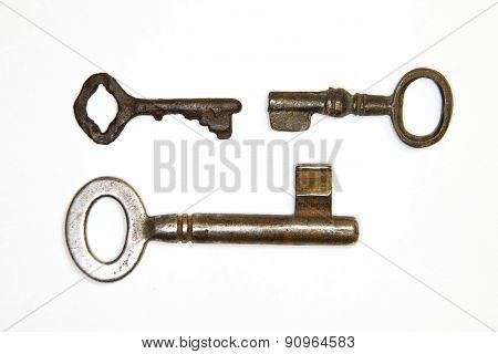 A Lot Vintage Keys From The Locks On A White Background
