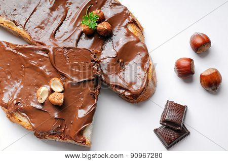 Bread With Chocolate Cream And Hazelnuts Isolated Top View