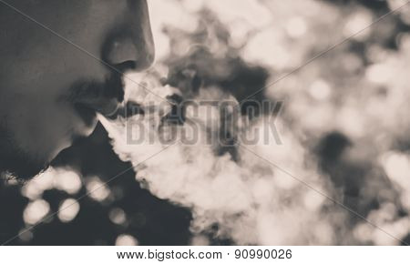 soft focus ,selection focus area , blurred background ,man smoking