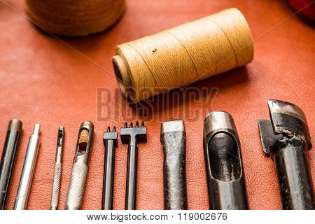 Leather crafting tools on work table