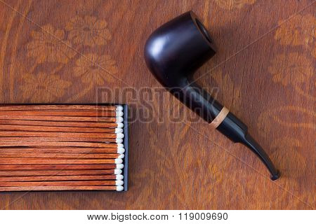 Luxury Tobacco Pipe On Wooden Desk