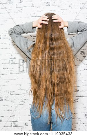 Young Woman With Very Long Wavy Brown And Blonde Hair