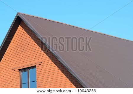 House With A Roof Made Of Metal Sheets