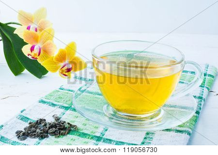 Cup Of Tea On Green Checkered Napkin