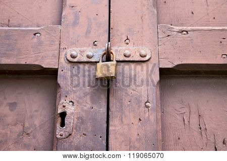 Abstract  Padlock Rusty   Knocker In A   Closed Wood Door  Gallarate Varese