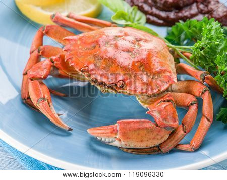 Seafood dish - cooked crab with lemon and herbs.