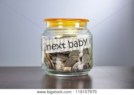 Saving Concept Of Coins In The Glass Jar For Nexy Baby  Purpose