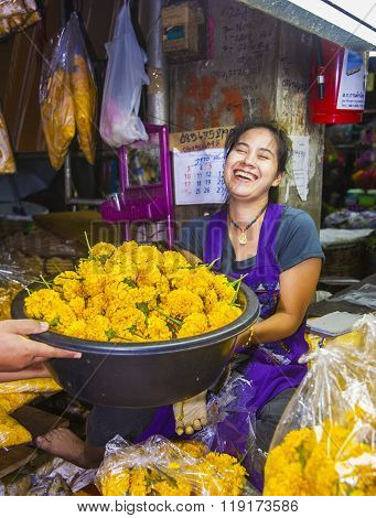 women are selling fresh flowers at the morning market Pak Khlong Thalat