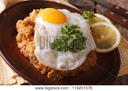 Egyptian Breakfast: Beans With A Fried Egg Close-up. Horizontal
