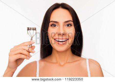 Close Up Portrait Of Smiling Girl Holding Culer For Eyelashes