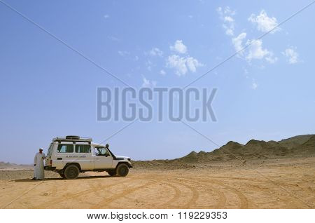 A Bedouin And A Tourist Car