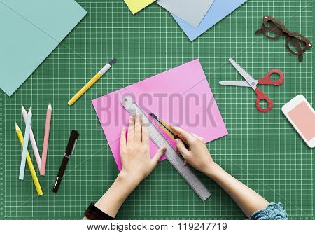 Woman Cutting Paper Stationery Workstation Concept