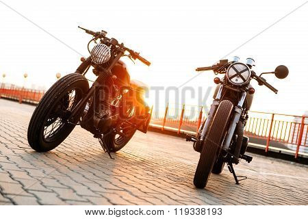 Two Black And Silver Vintage Custom Motorcycles Caferacers