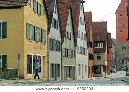 DINKELSBUHL GERMANY - AUGUST 10 2015: Street with historic houses in the Dinkelsbuhl city center. Dinkelsbuhl is old Franconian town one of the best-preserved medieval urban complexes in Germany.
