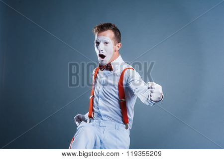 Two Funny Mimes Isolated On Gray Background