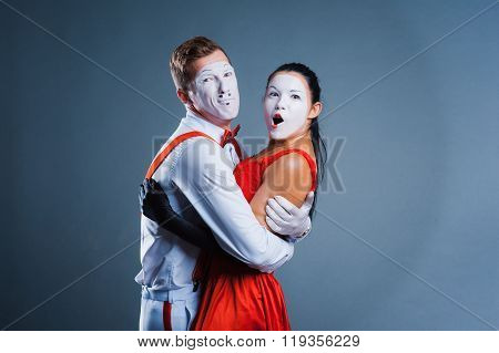 Two Funny Mimes Isolated On Gray Background