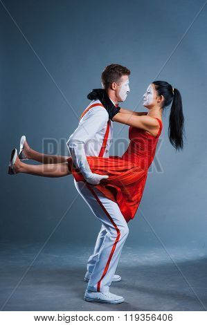Two Funny Mimes Isolated On Gray Background