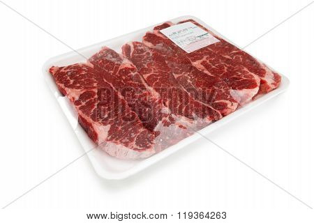 Fresh red meat packed in a poly bag.