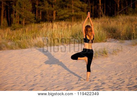 Beach yoga session by polish sea