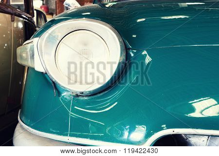 Close Up Of Headlight Lamp Vintage Classic Car. (vintage Effect Style)