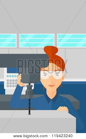 Woman working with boring mill.