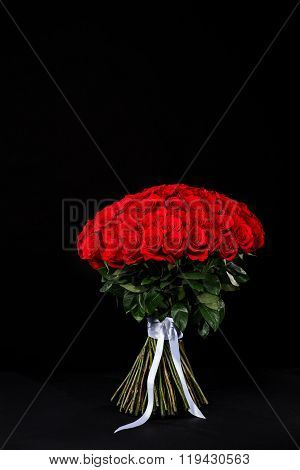Bouquet Of 101 Red Roses, Place For The Logo On A Black Studio Background