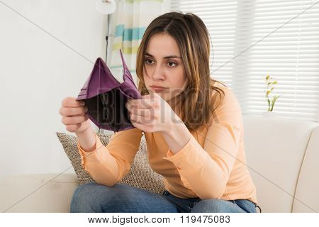 Shocked Woman Looking At Her Purse